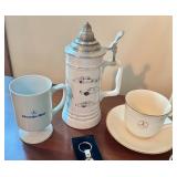 Mercedes-Benz Collectibles Set with Mugs, Patches, Book, Hat, and Keychains Mercedes-Benz Collectibles Set with Mugs, Patches, Book, Hat, and Keychains