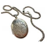 Sterling Silver 20 Inch Chain with Engraved Oval Locket Pendant Sterling Silver 20 Inch Chain with Engraved Oval Locket Pendant