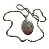 Sterling Silver 20 Inch Chain with Engraved Oval Locket Pendant Sterling Silver 20 Inch Chain with Engraved Oval Locket Pendant