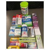 Assorted Health and Wellness Products Including Supplements, Pain Relief, and Personal Care