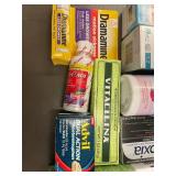 Assorted Health and Wellness Products Including Supplements, Pain Relief, and Personal Care