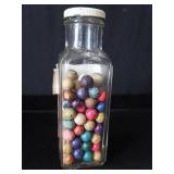 VINTAGE JAR FILLED WITH CLAY MARBLES