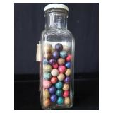 VINTAGE JAR FILLED WITH CLAY MARBLES