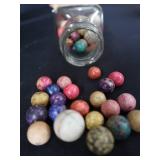 VINTAGE JAR FILLED WITH CLAY MARBLES