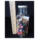 VINTAGE JAR FILLED WITH CLAY MARBLES