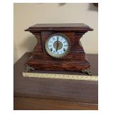 Antique Wooden Mantel Clock with Roman Numeral Dial and Metal Feet