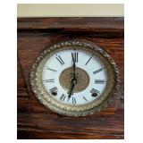 Antique Wooden Mantel Clock with Roman Numeral Dial and Metal Feet