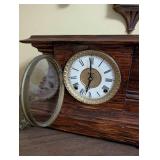 Antique Wooden Mantel Clock with Roman Numeral Dial and Metal Feet