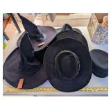 Assorted Black Hats Including Witch Hats, Cowboy Hats, and Greek Fisherman Cap