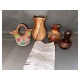 Collection of 4 Native American-Style Pottery Vases with Etched and Painted Designs