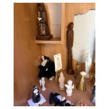 Collection of Religious Figurines and Statues Featuring Nuns and Saints