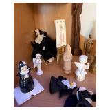 Collection of Religious Figurines and Statues Featuring Nuns and Saints