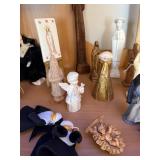 Collection of Religious Figurines and Statues Featuring Nuns and Saints