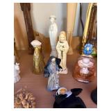 Collection of Religious Figurines and Statues Featuring Nuns and Saints