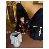 Collection of Religious Figurines and Statues Featuring Nuns and Saints