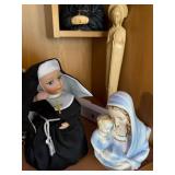 Collection of Religious Figurines and Statues Featuring Nuns and Saints