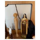 Collection of Religious Figurines and Statues Featuring Nuns and Saints