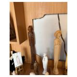 Collection of Religious Figurines and Statues Featuring Nuns and Saints