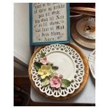 Collection of Decorative Plates, Bowls, and Framed Art with Scandinavian Motifs