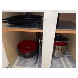 Collection of Metal Baking Racks and Red Cooking Pots with Lids