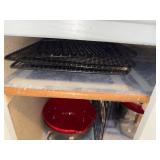 Collection of Metal Baking Racks and Red Cooking Pots with Lids