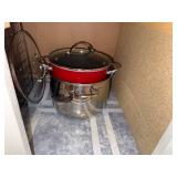 Collection of Metal Baking Racks and Red Cooking Pots with Lids