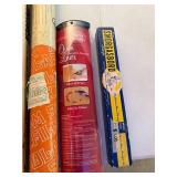 Group of Vintage Household Items Including GE Projector Lamp, Solar-X Window Film, Oven Liner, and Smorgasbord Party Game