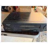 Soundesign Radio, Magnavox DVD Player, Sharp VCR, and Cable Lot