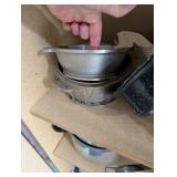 Tall Oak-Look Kitchen Storage Cabinet with Assorted Cookware and Bakeware