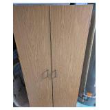 Tall Oak-Look Kitchen Storage Cabinet with Assorted Cookware and Bakeware