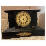 Antique Black Mantel Clock with Ornate Lion Head Details