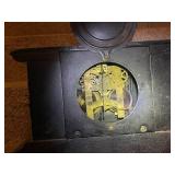 Antique Black Mantel Clock with Ornate Lion Head Details