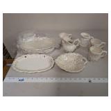 Collection of Embossed White Ceramic Serving Pieces and Mugs