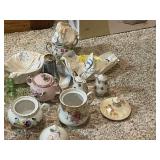 Collection of Vintage Miniature Porcelain Tea Sets and Decorative Dishes