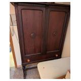 Vintage Wood Cabinet with Ornate Detailing and Drawer