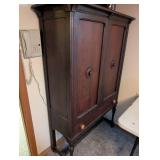 Vintage Wood Cabinet with Ornate Detailing and Drawer