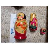 Vintage Home Decor Lot with Carved Bookends, Wall Plaque, Brass Plate, and Nesting Dolls