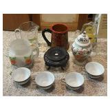 Collection of Porcelain Tea Cups, Decorative Pitchers, and Oriental Jar