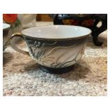 Collection of Porcelain Tea Cups, Decorative Pitchers, and Oriental Jar