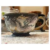 Collection of Porcelain Tea Cups, Decorative Pitchers, and Oriental Jar