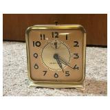Collection of 4 Vintage Alarm Clocks Including Wind-Up and Electric