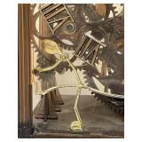 Vintage Skeleton Clock with Exposed Gears and Roman Numerals