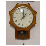 United Clock Corp Wall Clock with Roman Numerals and Pendulum