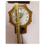United Clock Corp Wall Clock with Roman Numerals and Pendulum