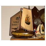 Collection of Nautical Decor with Model Boats and Ship Wheel Clocks