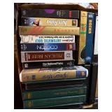 Box of VHS Tapes and Golf Books Including The Sound of Music, North to Alaska, Mastering Trouble Shots