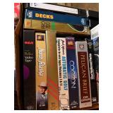 Box of VHS Tapes and Golf Books Including The Sound of Music, North to Alaska, Mastering Trouble Shots