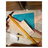 Collection of Quilting Mats, Gridded Rulers, and Cutting Tools