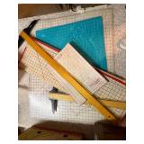 Collection of Quilting Mats, Gridded Rulers, and Cutting Tools