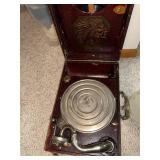 Antique Portable Phonograph with Native American Motif and Record Collection